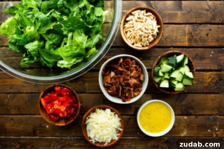 The Ultimate House Salad Recipe 4 A beautifully arranged flat lay photo showcasing all the fresh ingredients for Salad de Maison, each neatly placed in separate bowls on a rustic wooden table, ready for assembly.