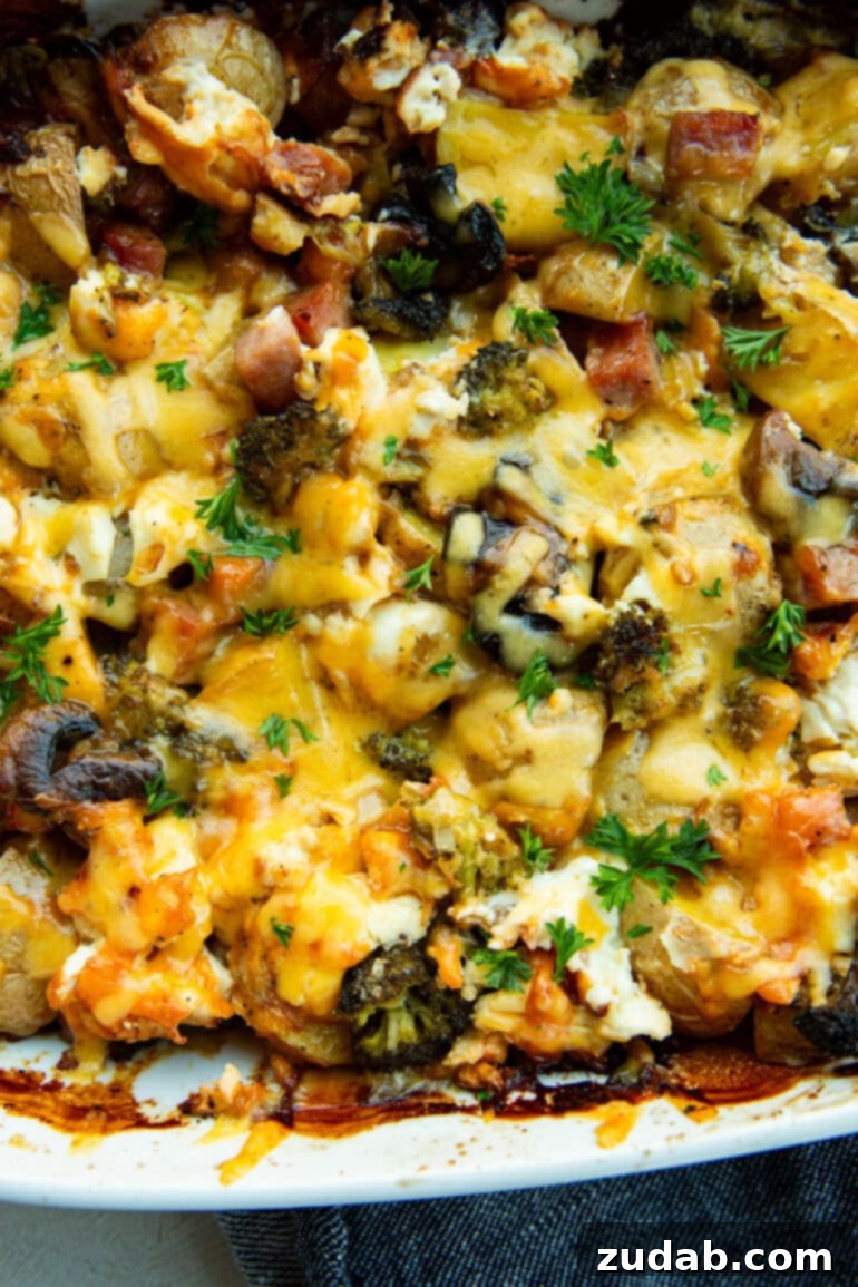Classic Cheesy Ham, Potato & Broccoli Bake 6 A beautifully baked cheesy ham, potato, and broccoli casserole with golden brown mushrooms on top, served in a ceramic baking dish