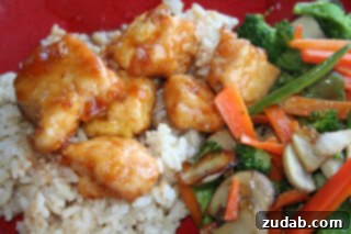 Umami Teriyaki Beef Handheld 4 sweet and sour chicken with vibrant colors and fresh ingredients