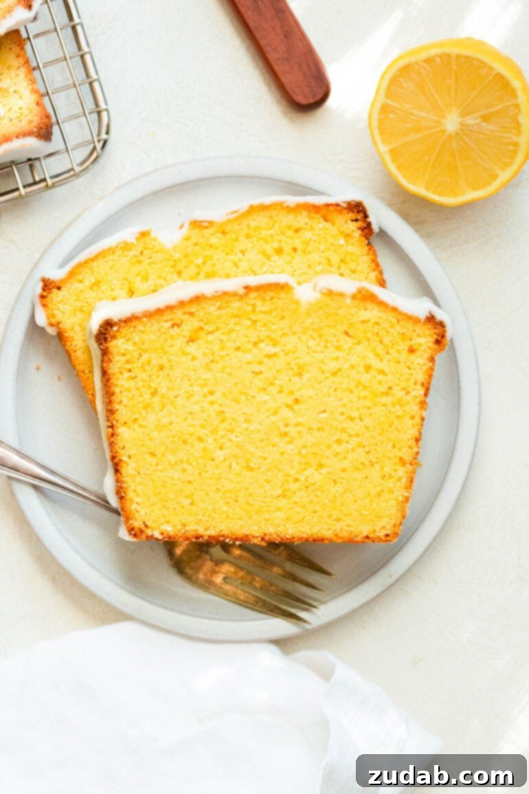 Zesty Lemon Glaze Loaf 6 a photo of two slices of glazed lemon pound cake
