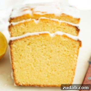 Zesty Lemon Glaze Loaf 9 a photo of two slices of glazed lemon pound cake