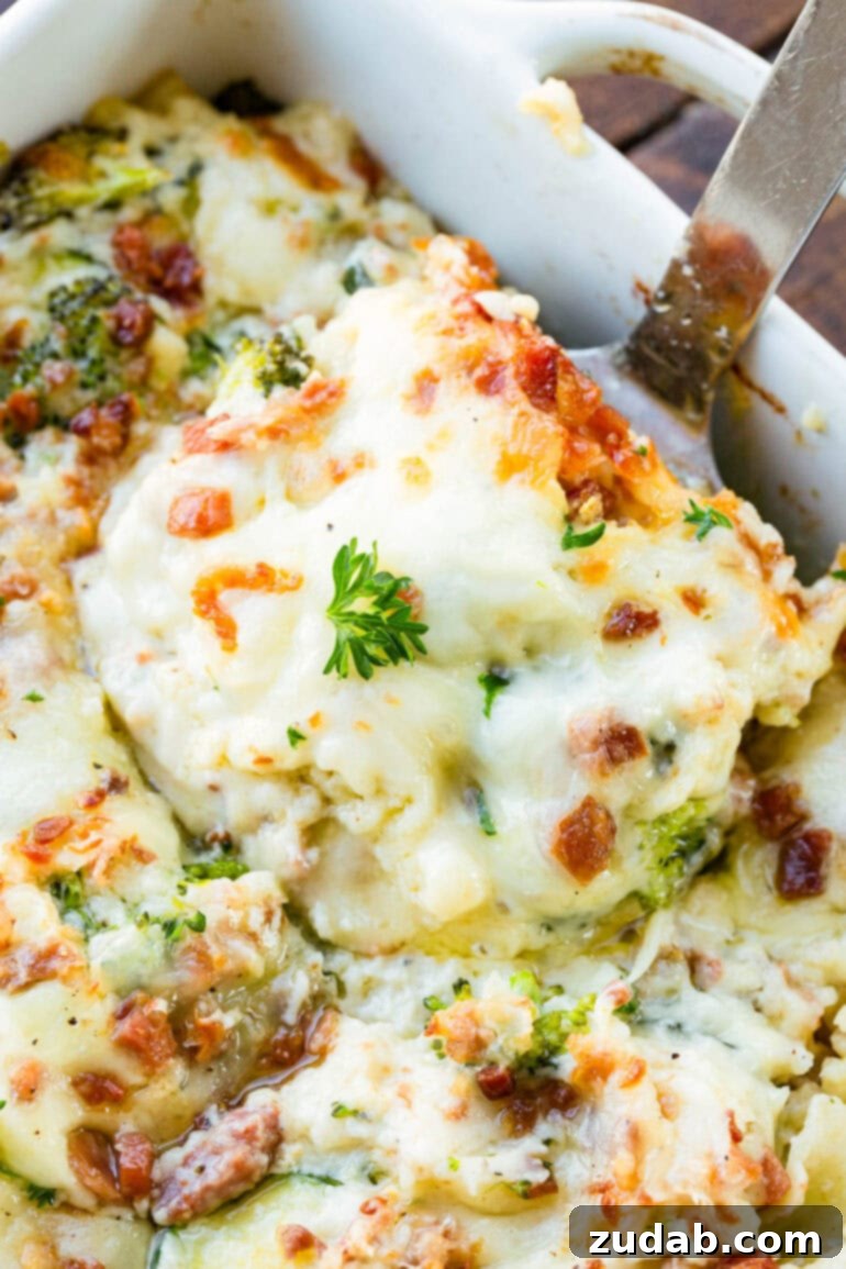 Creamy Vegetable Lasagna with Crispy Pancetta 12 A serving of creamy white vegetable lasagna being scooped out of a full pan, ready to be enjoyed.