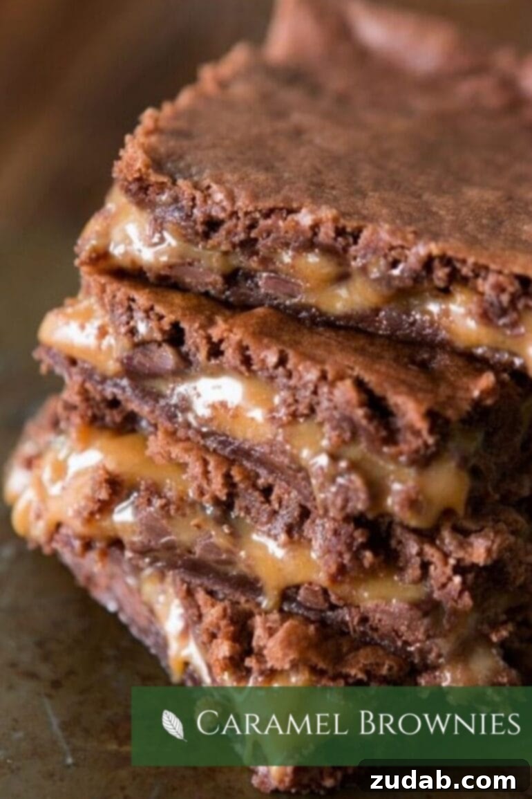 A delectable photo of a stack of fudgy caramel brownies, showcasing their rich, dense texture and gooey caramel swirls.