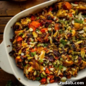 Nourishing Chicken Harvest Bake 10 A photo of a white baking dish full of a colorful harvest chicken casserole