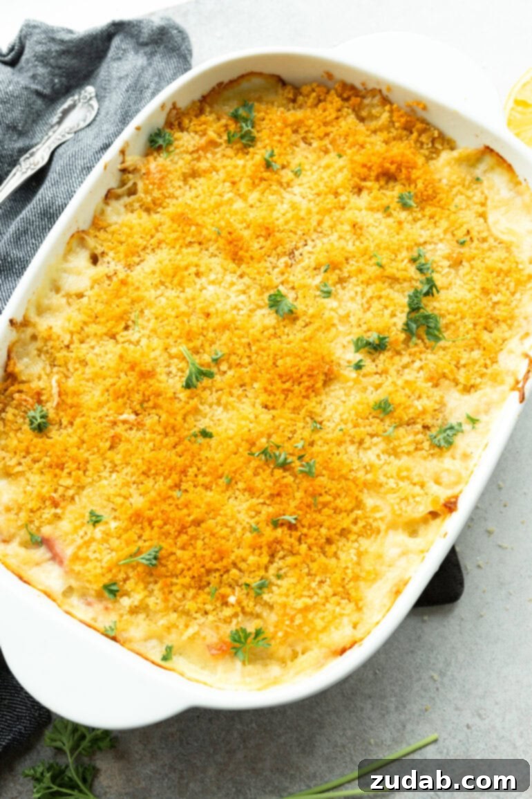 Creamy Chicken Cordon Bleu Casserole 7 A close-up photo of a baked Chicken Cordon Bleu Casserole, showcasing its golden-brown panko breadcrumb topping and creamy interior.