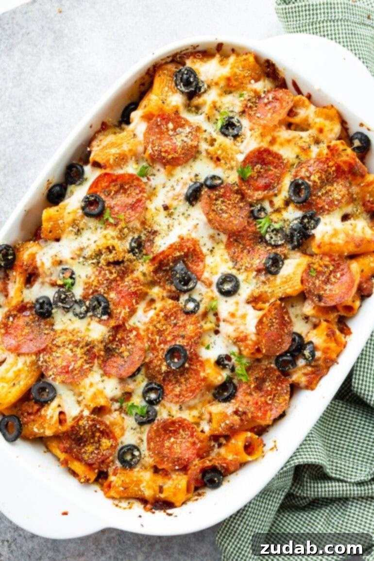 One-Pan Pizza Night Delight 3 a photo of a casserole dish full of baked pizza pasta casserole