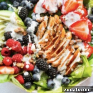 Fresh & Fit Berry Avocado Chicken Salad 10 A top-down view of Berry Avocado Chicken Salad, with grilled chicken slices, vibrant berries, and a creamy dressing, in a square format for the recipe card.