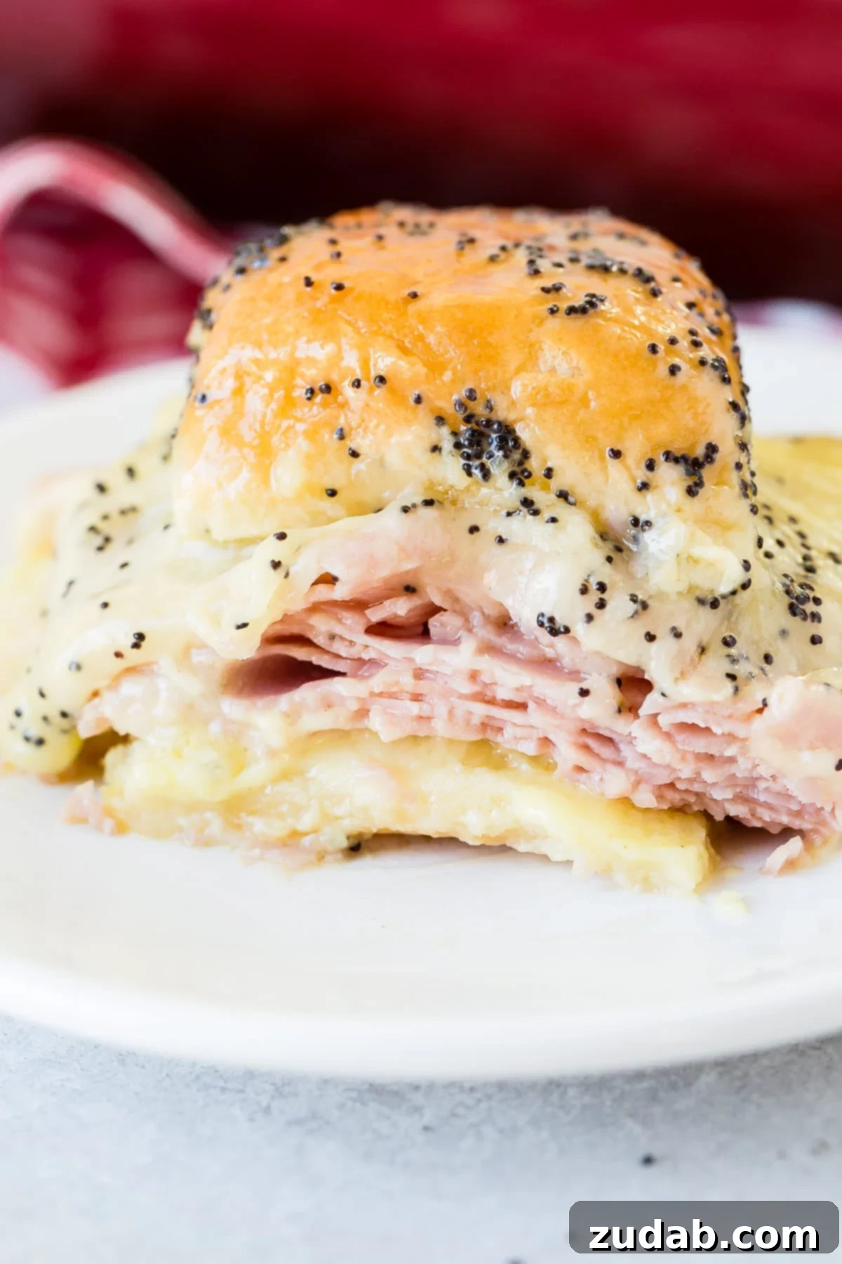 Melty Ham and Cheese Buns 6 Ham and cheese sliders with poppy seed dressing: The ultimate recipe for delicious leftover ham.