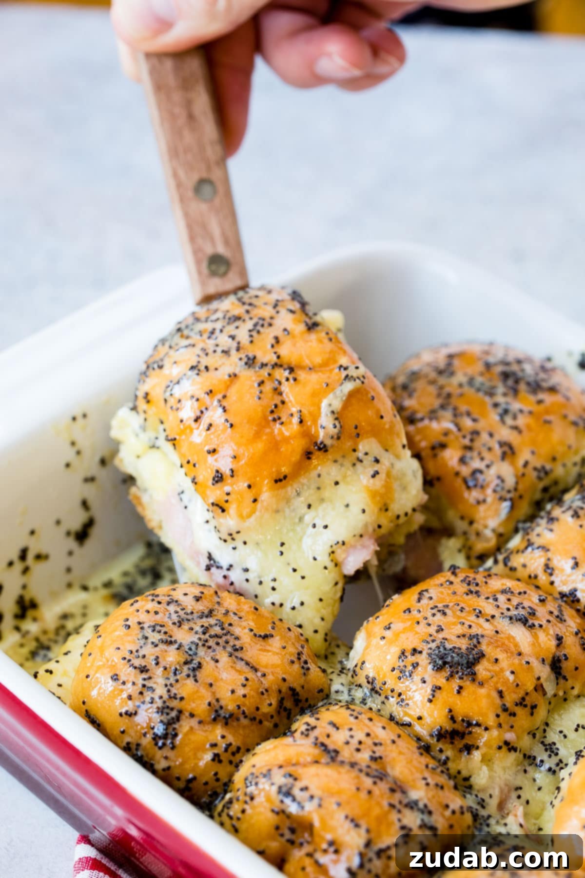 Melty Ham and Cheese Buns 9 A large pan of delicious ham and cheese sliders, ready to be served at a party or family meal.