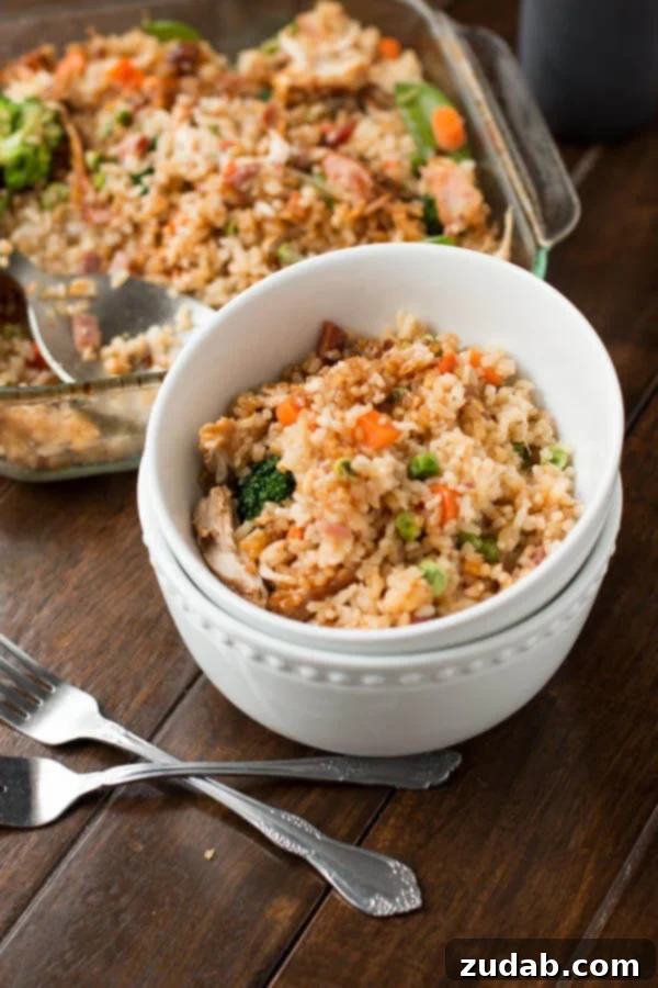 The Best Teriyaki Chicken Casserole 5 Teriyaki chicken casserole served in stacked white bowls, ready to enjoy.