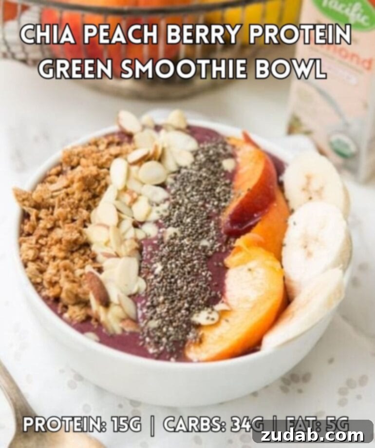 Power Protein Recipes 2 A vibrant bowl filled with a berry protein smoothie, beautifully topped with sliced bananas, juicy peaches, chia seeds, delicate sliced almonds, and crunchy granola.
