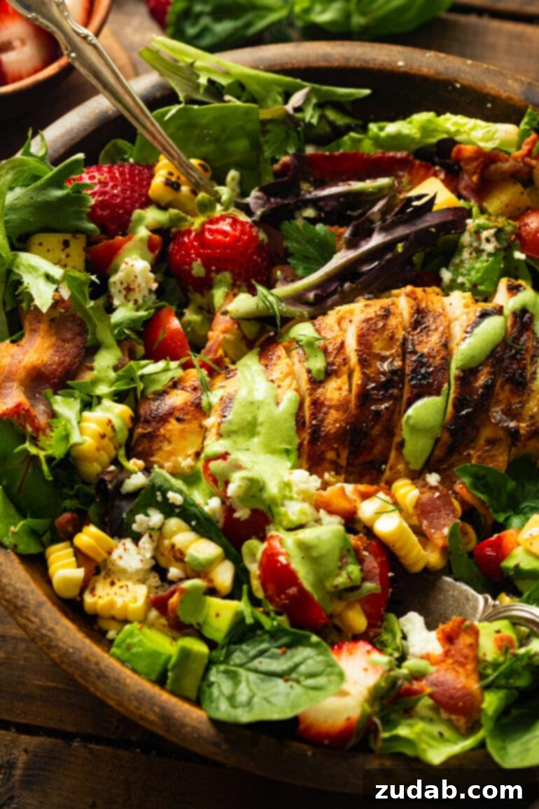 Summer Grilled Chicken Salad with Creamy Basil Dressing 4 a photo of large summer salad with grilled chicken topped with a creamy basil dressing