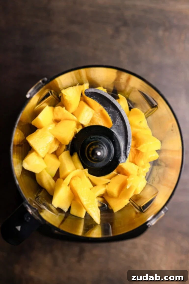 Step 8: Peeled and sliced mangoes, with some reserved for garnish.
