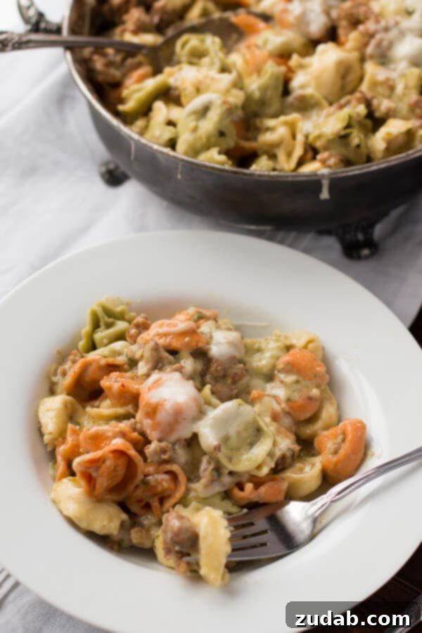 Easy Low-Calorie Pesto Tortellini Recipe Creamy pesto sauce with a fraction of the calories but you'd never guess it ohsweetbasil.com sausage, tortellini, pesto, mozzarella