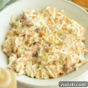 The Secret to Amazing Homemade Coleslaw 6 A beautiful bowl of homemade creamy coleslaw, ready to serve.