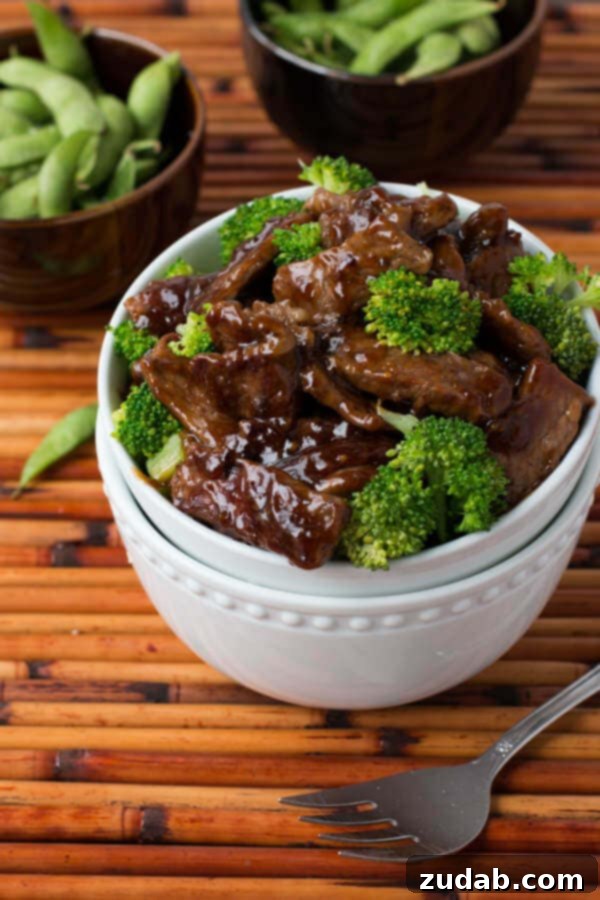 Ingredients for a homemade beef and broccoli recipe laid out on a kitchen counter.