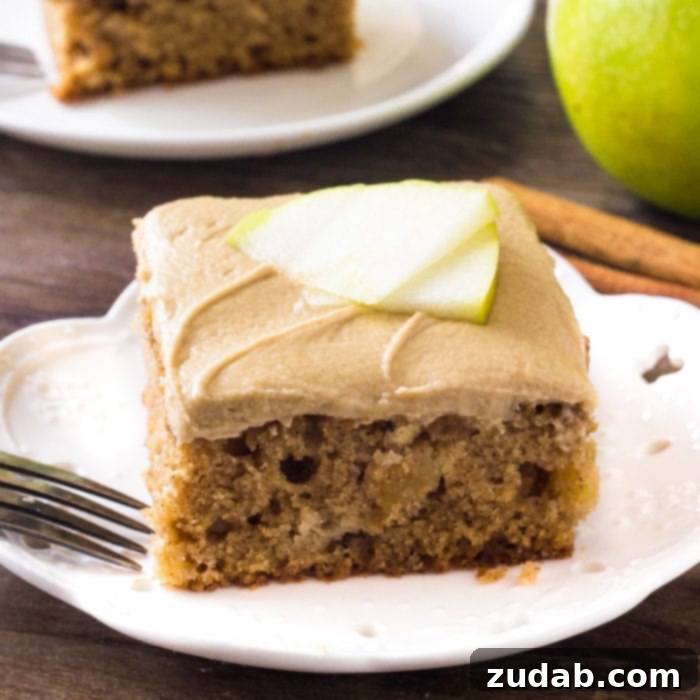 Pumpkin and Apple Perfection: Your Fall Dessert Obsession 10 A generous slice of moist apple cake topped with a luscious caramel frosting.