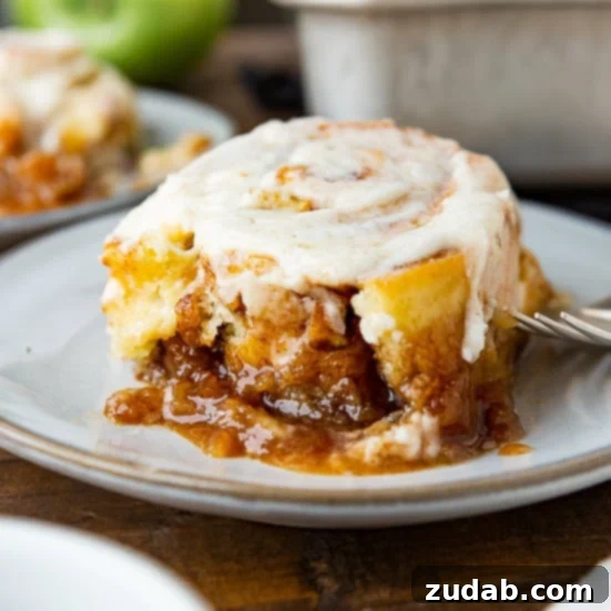 Pumpkin and Apple Perfection: Your Fall Dessert Obsession 11 Warm, sticky apple cinnamon rolls, drizzled with glaze, fresh from the oven and ready to enjoy.