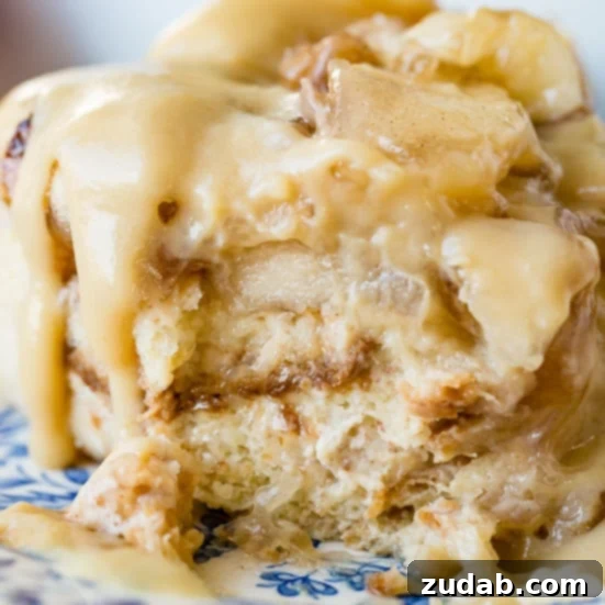 Pumpkin and Apple Perfection: Your Fall Dessert Obsession 13 Warm apple pie bread pudding, drizzled with vanilla sauce, a comforting fall dessert.