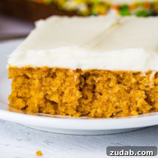 Pumpkin and Apple Perfection: Your Fall Dessert Obsession 6 A large, frosted pumpkin sheet cake, perfectly cut into squares, ready for a crowd.
