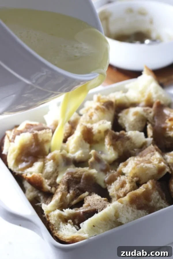 Gooey Caramel Cinnamon Roll Baked French Toast Casserole for breakfast or brunch Close-up of the gooey caramel and cinnamon layers inside the French Toast Casserole, ready to be enjoyed