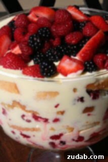 A refreshing Lemon Curd Berry Trifle, layered with berries and creamy lemon curd.
