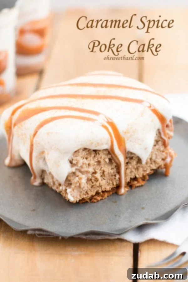 Homemade Caramel Spice Poke Cake with creamy topping Fluffy whipped cream topping on a caramel spice poke cake