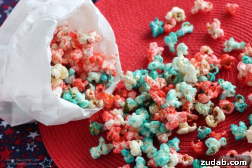 Patriotic Popcorn, 4th of July, summer food Freshly popped blue patriotic popcorn in a pot with a clear lid