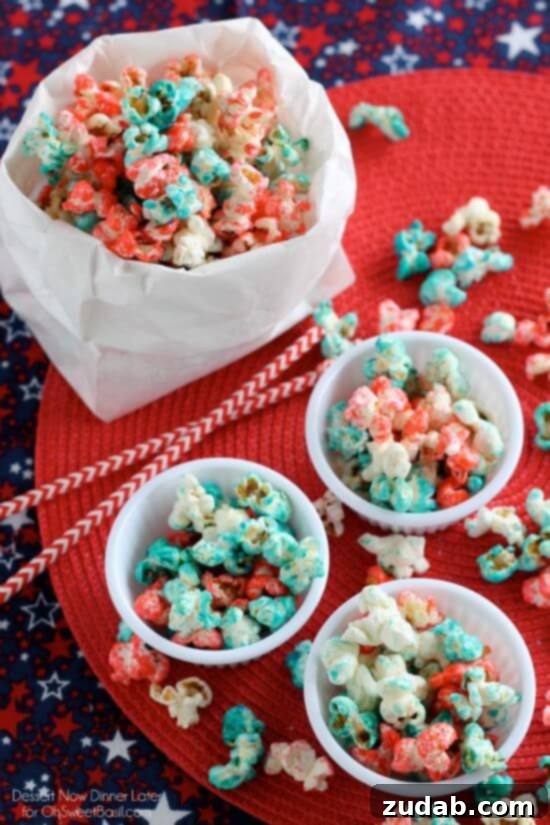 Patriotic Popcorn, 4th of July, summer food A large bowl of patriotic red, white, and blue popcorn with a serving scoop