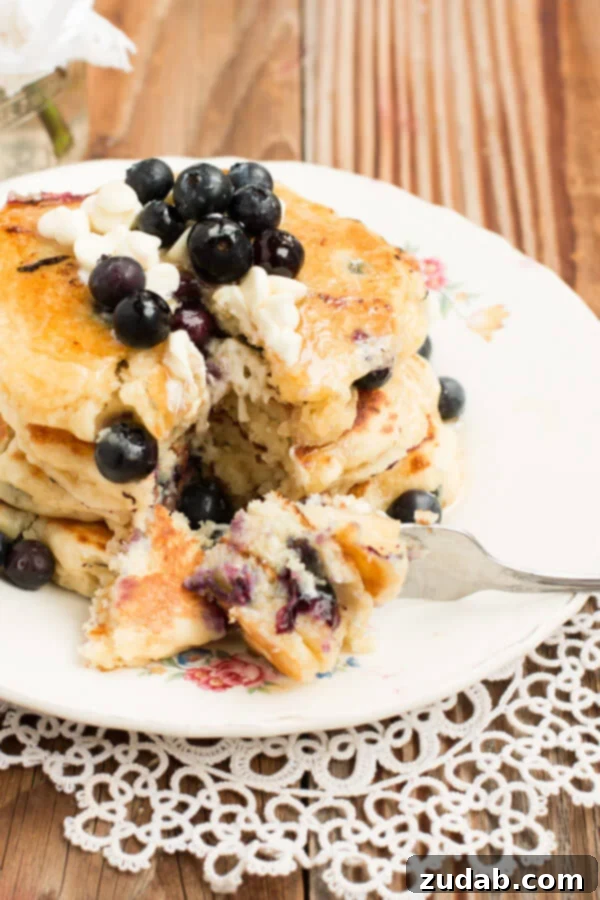 White Chocolate Blueberry Pancakes - A Perfect Weekend Treat Delicious White Chocolate Blueberry Pancakes Stacked High