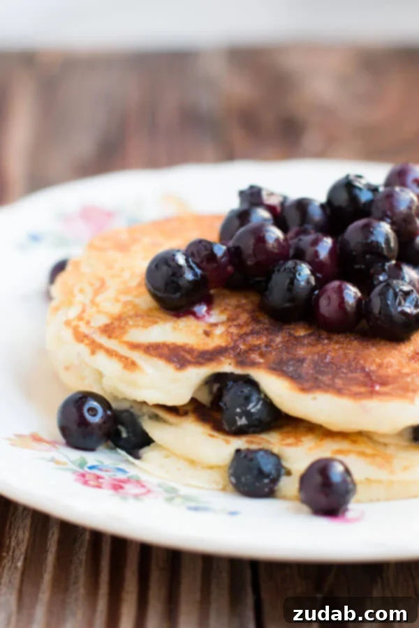 White Chocolate Blueberry Pancakes - A Sweet and Creamy Delight Close-up of fluffy White Chocolate Blueberry Pancakes