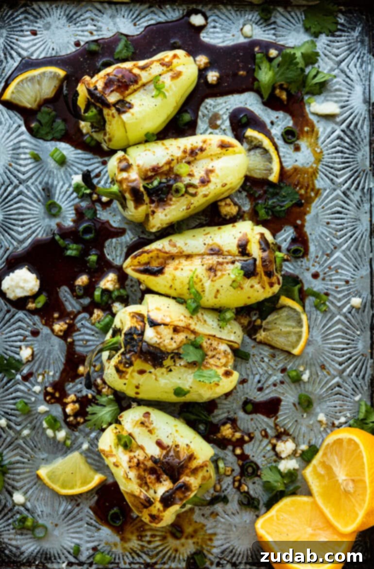 Melty Cheese-Loaded Grilled Peppers 2 a photo of several cheesy stuffed grilled peppers