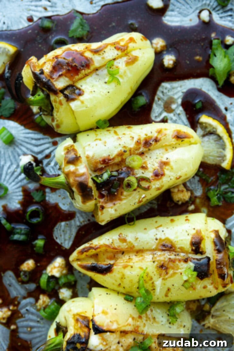 Melty Cheese-Loaded Grilled Peppers 4 a photo of several grilled peppers stuffed with melted cheese