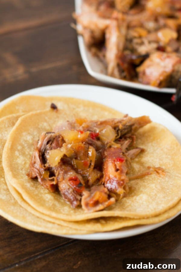 Versatile Pineapple Habanero Pork Serving Ideas Various delicious serving suggestions for slow cooker pineapple habanero pork, including vibrant tacos, satisfying rice bowls, or enjoyed simply on its own, garnished with fresh cilantro.