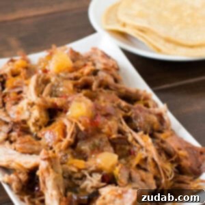 Holy Amazing pineapple habanero pork! A 3-ingredient slow cooker recipe that is incredibly tender and flavorful. Perfect for an Instant Pot or Crock Pot.