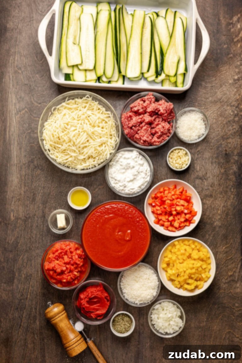 The BEST zucchini lasagna we've ever had! ohsweetbasil.com The ingredients to make zucchini lasagna are laid out on a wooden table in individual bowls, neatly organized and ready for cooking.