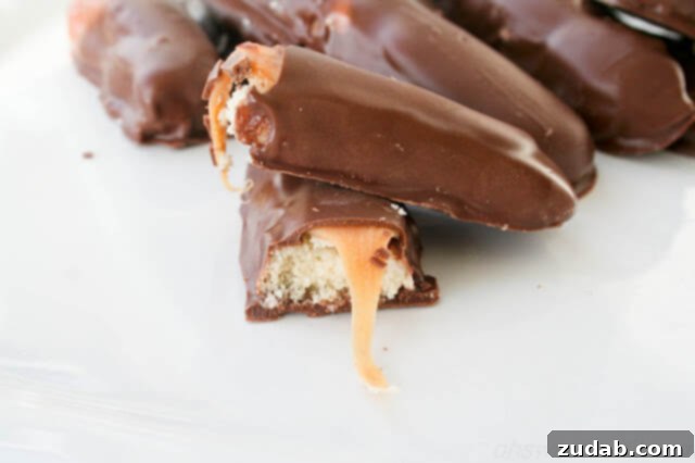 Twix Caramel Dream Bars 4 Homemade Twix candy bars with a crisp shortbread base, chewy caramel, and smooth chocolate coating.