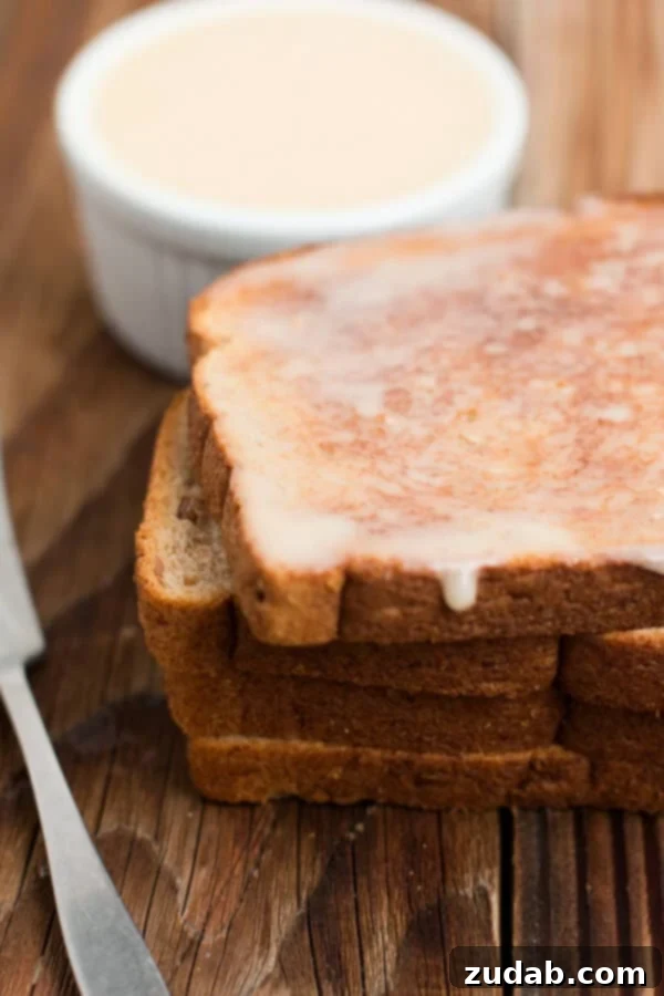 The best blasted honey butter ever. ohsweetbasil.com A bowl of creamy, homemade honey butter, ready to be spread on your favorite bread, emphasizing its smooth texture.