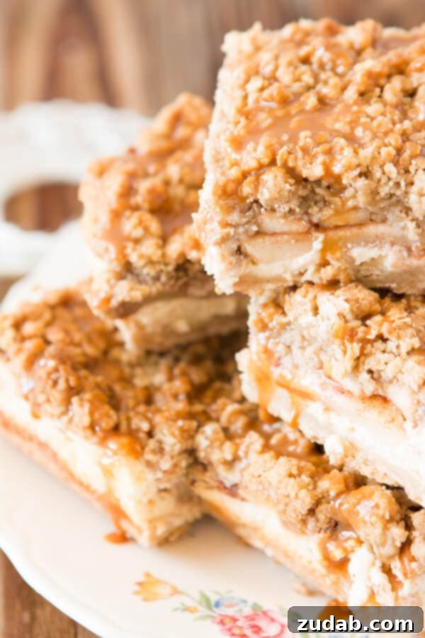 Delicious Cheesecake Walnut Caramel Apple Crisp Bars with a rich, nutty oat topping. Perfect for dessert lovers seeking a delightful crunch and creamy texture. #FisherNuts #AppleCrisp