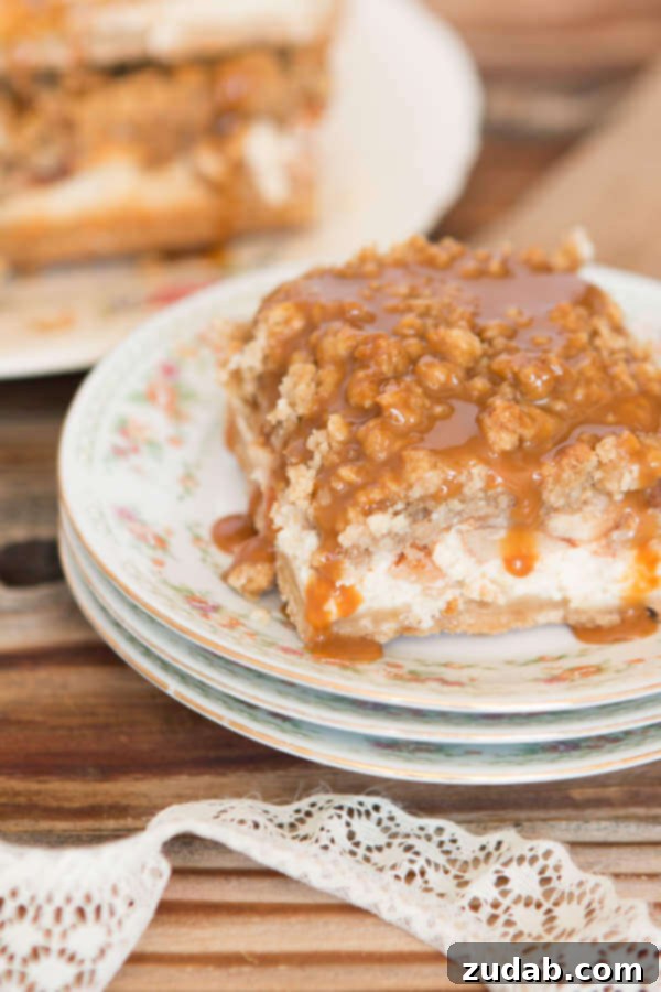 Cheesecake Walnut Caramel Apple Crisp Bars featuring a hidden walnut oat topping. A perfect blend of creamy cheesecake, tender apples, and crunchy walnuts from Fisher Nuts. #ThinkFisher