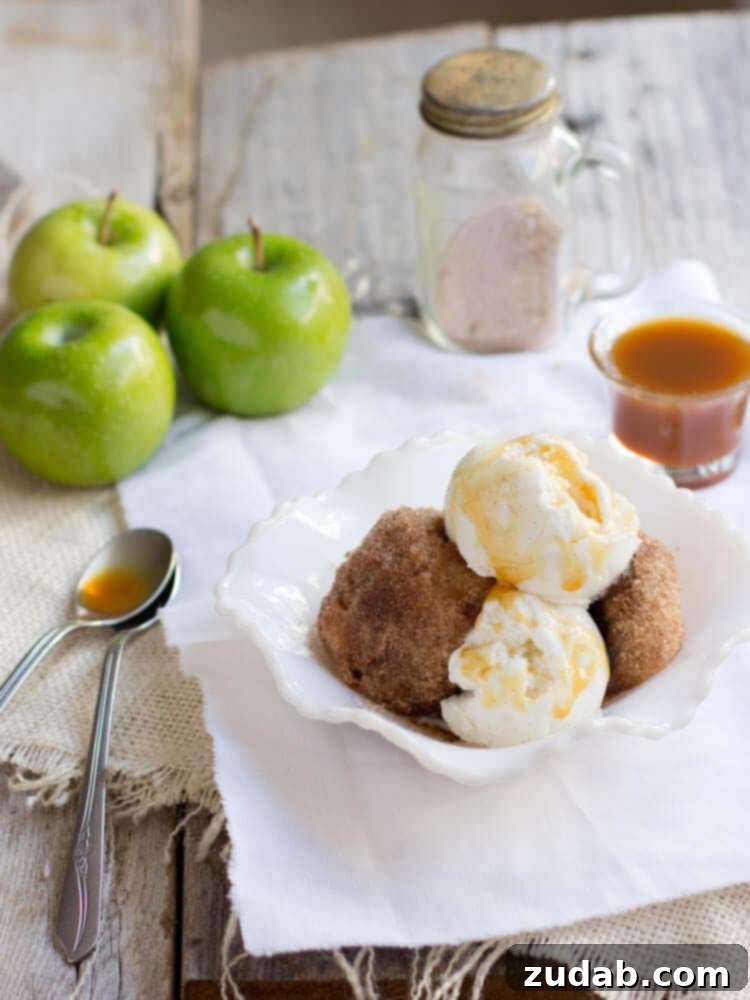 Golden brown deep fried apple pie, a crispy and sweet dessert filled with warm, spiced apples. A comforting and nostalgic treat.