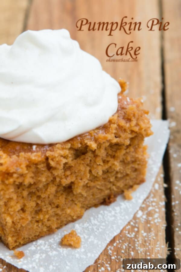 A slice of Pumpkin Pie Cake ready to be served. Close-up of a golden brown Pumpkin Pie Cake, showing its delightful cake-like texture.