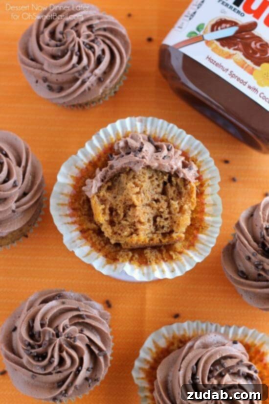 Pumpkin Cupcakes with Nutella Frosting Row of Pumpkin Cupcakes with Nutella Frosting