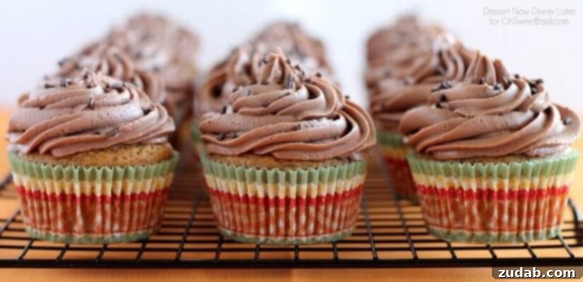 Pumpkin Cupcakes with Nutella Frosting Pumpkin Cupcakes with Nutella Frosting and a spoon
