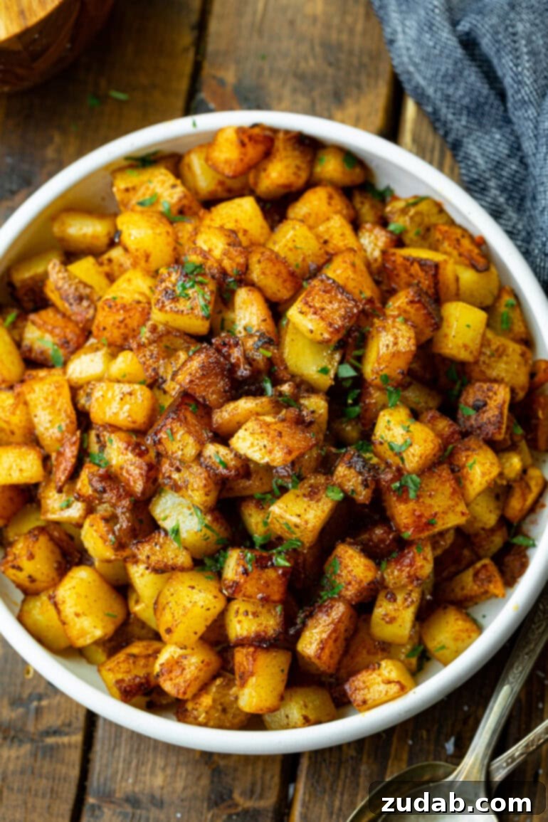 Smoky Fried Potatoes 4 a photo of a large serving bowl of golden crispy fried potatoes
