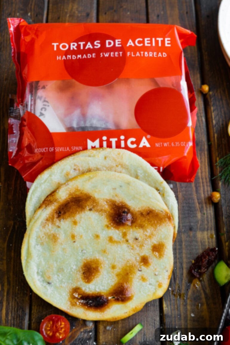Vibrant Greek Turkey or Chicken Tostadas 6 a photo of an empty package for spanish flatbread with two pieces of the flatbread sitting on top of it.