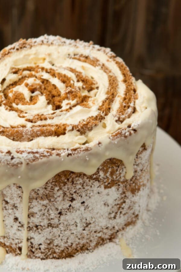 Easy Pumpkin Roll White Chocolate Cake Recipe for a Memorable Holiday Dessert Delicious Pumpkin Roll White Chocolate Cake, a perfect festive dessert for holiday parties.