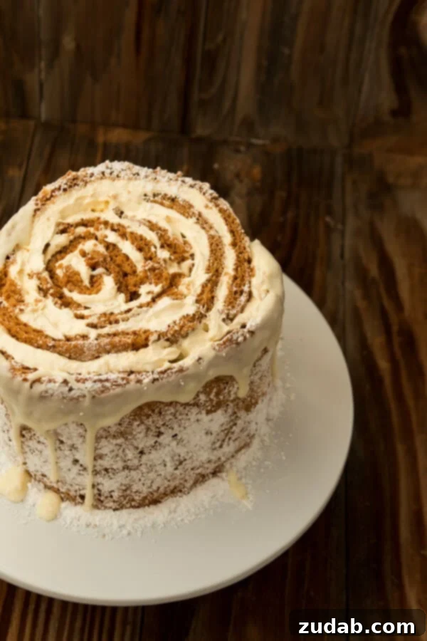 Mastering the Art of Rolling Your Pumpkin Roll White Chocolate Cake Hand-rolling a pumpkin cake sheet for the white chocolate cake, showcasing the simple technique.