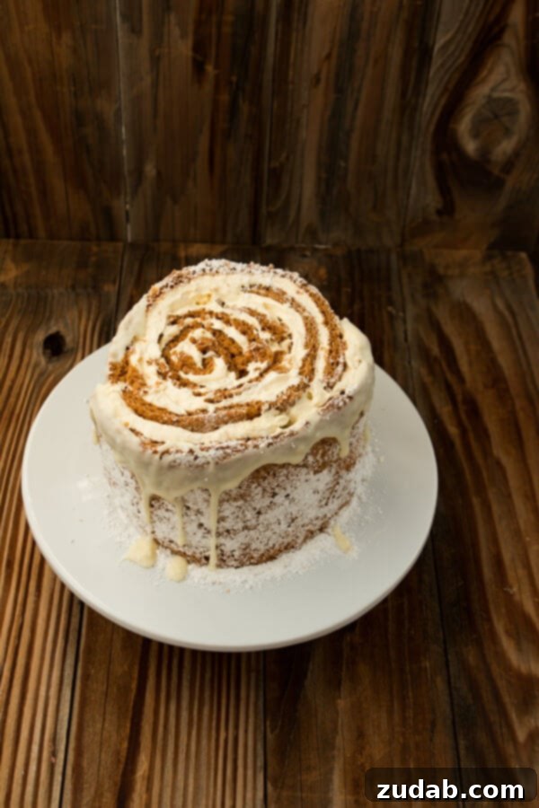 Serving Perfection: Enjoying Your Homemade Pumpkin Roll White Chocolate Cake Slicing a generous piece of Pumpkin Roll White Chocolate Cake, showing the beautiful layers and creamy filling.