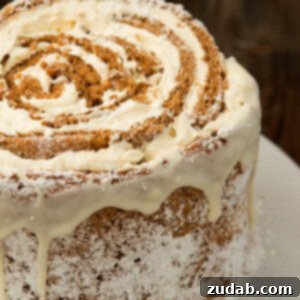 Spiced Pumpkin White Chocolate Swirl Cake 2 Festive Pumpkin Roll White Chocolate Cake, a delightful holiday dessert.